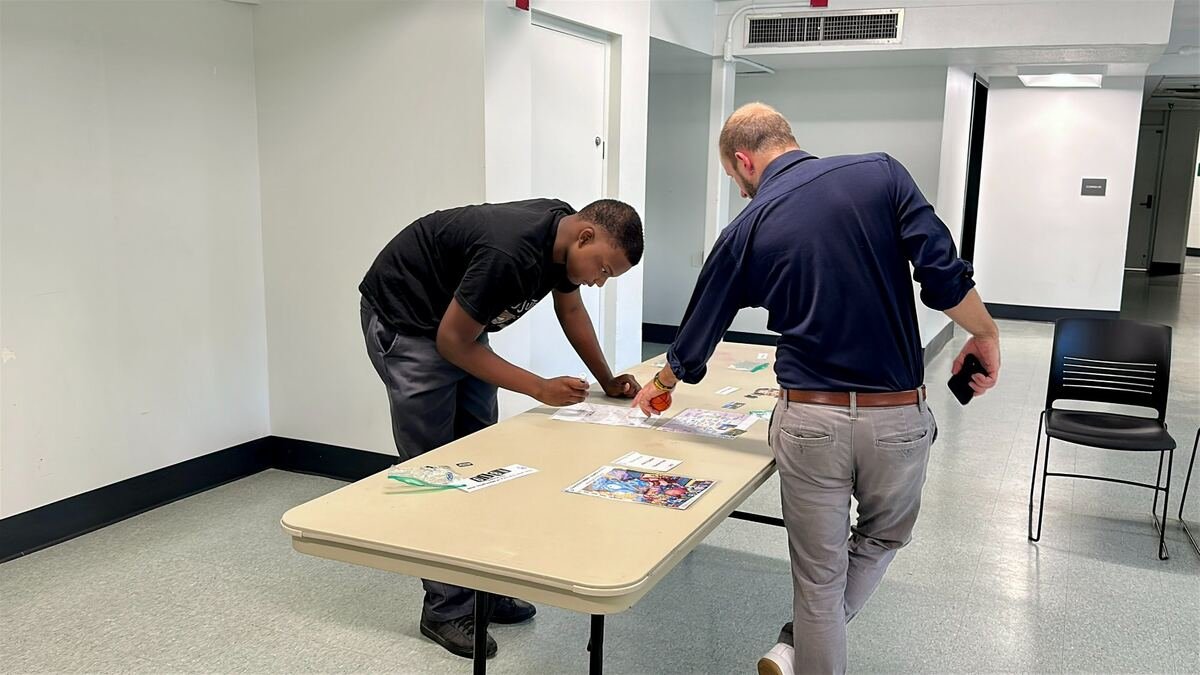 MYDG mentor and youth at table